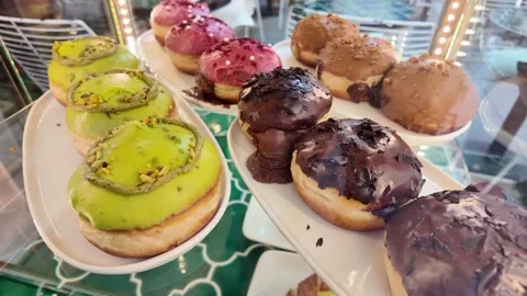 Delicious donuts on display at a bakery filled with sweet treats Stock-Footage 345697387