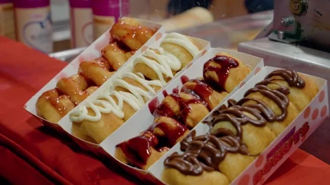 Delicious donuts filled with jam served at a festive Christmas market Stock Footage 315226386