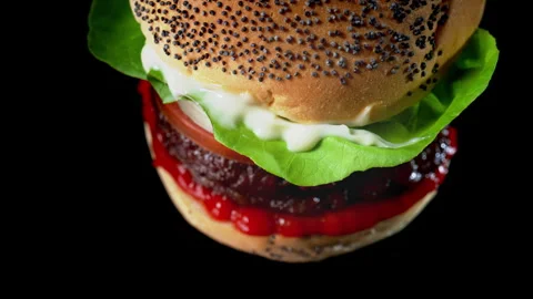 Delicious double burger on the black background Stockbeeldmateriaal 335469704