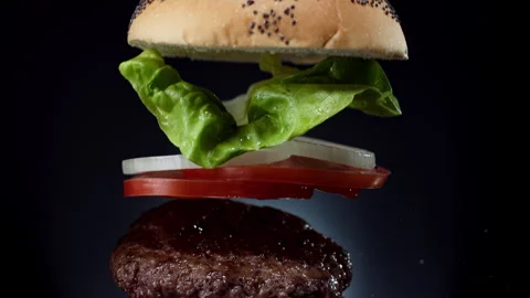 Delicious double burger on the black background Stockbeeldmateriaal 335469777