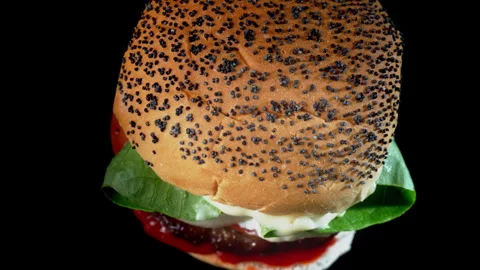 Delicious double burger on the black background Stock Footage 335469785