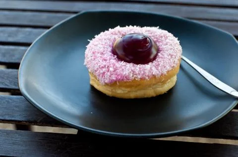Delicious  doughnut  on the disk Stock Photos