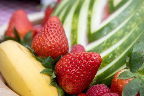 A delicious down of fruit showing a close up view of the ripe strawberries Stock Photos