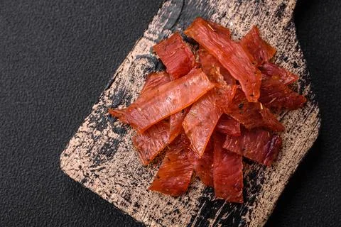 Delicious dried veal or turkey jerky with salt, spices and herbs Stock Photos