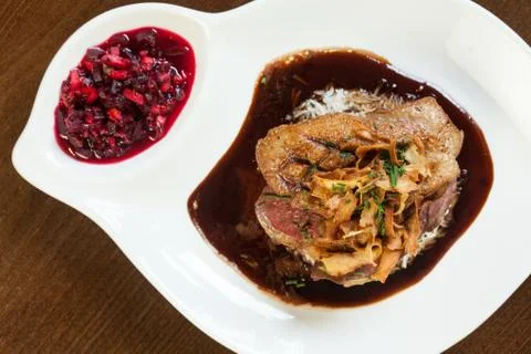 Delicious duck breast dish with gravy and rice Stock Photos