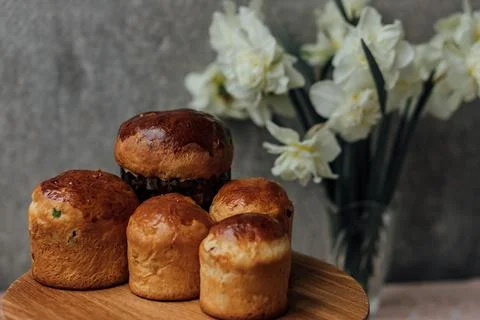 Delicious Easter cake and ingredients on wooden table Stock Photos