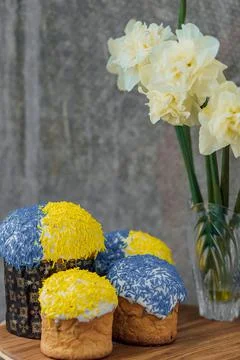 Delicious Easter cake and ingredients on wooden table. Stock Photos