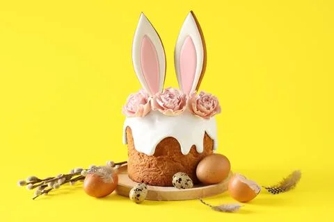 Delicious Easter cake with bunny ears, pussy willow branches and eggs on yell Stock Photos