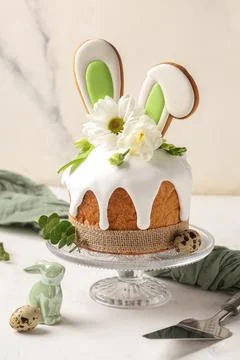 Delicious Easter cake with bunny ears, different flowers, eucalyptus branches Stock Photos