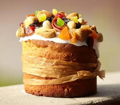 Delicious Easter Cake decorated with sweets, dried fruits and nuts, bounded u Stock Photos