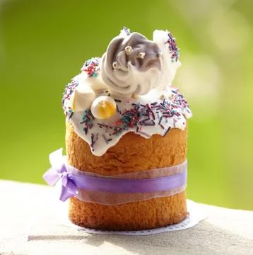 Delicious Easter Cake decorated with sweets, meringue, bounded up with purple Stock Photos