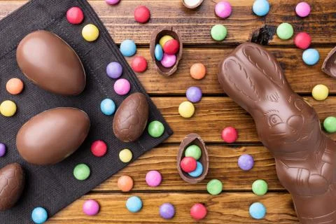 Delicious Easter chocolate bunny, eggs and sweets Stock Photos