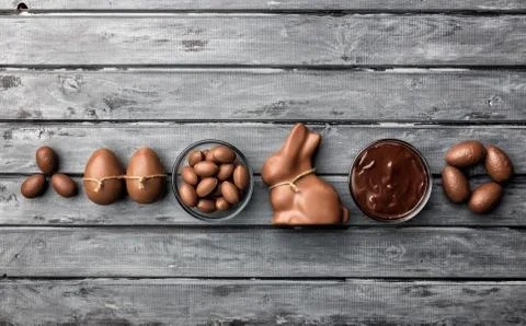 Delicious Easter chocolate bunny, eggs and sweets Stock Photos
