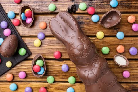Delicious Easter chocolate bunny, eggs and sweets Stock Photos