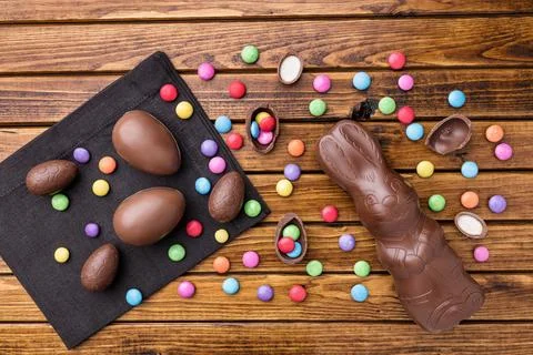Delicious Easter chocolate bunny, eggs and sweets Stock Photos