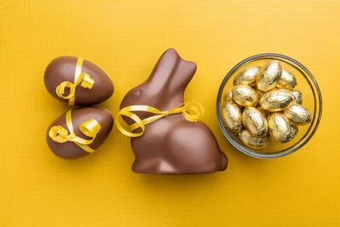 Delicious Easter chocolate bunny, eggs and sweets Stock Photos