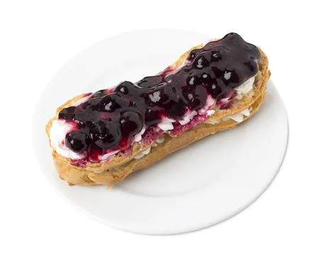 Delicious eclair with berry jam. Stock Photos
