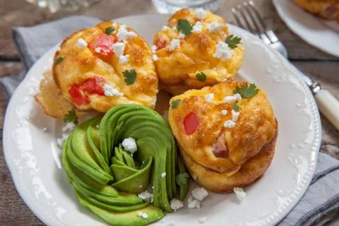 Delicious egg muffins with ham, cheese and vegetables 스톡 사진