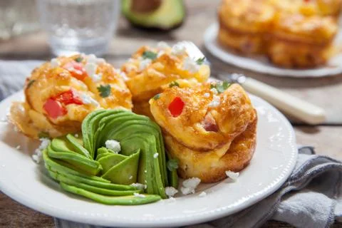 Delicious egg muffins with ham, cheese and vegetables Stock Photos