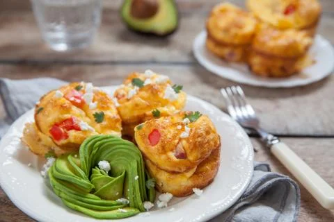 Delicious egg muffins with ham, cheese and vegetables Stock Photos