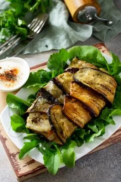 Delicious fish baked with vegetables in an eggplant grilled. Fotos Stock