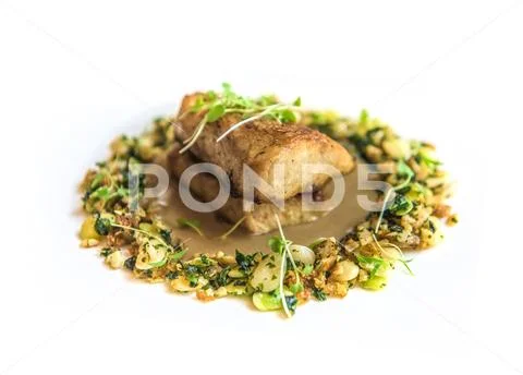 Delicious fish dish at gourmet restaurant Stock Photos