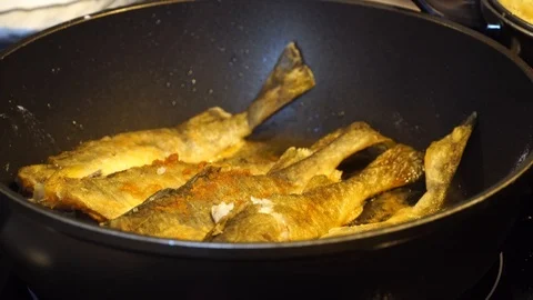 Delicious fish fried in a pan Stock Footage 125009481