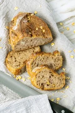 Delicious fresh baked bread on rustic background. Stock Photos