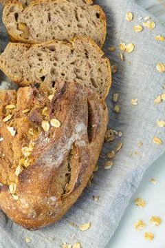 Delicious fresh baked bread on rustic background. Stock-Fotos