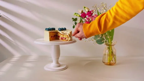 Delicious fresh bento sponge cake decorated with berries and pattern with cut Stock Footage 240458601