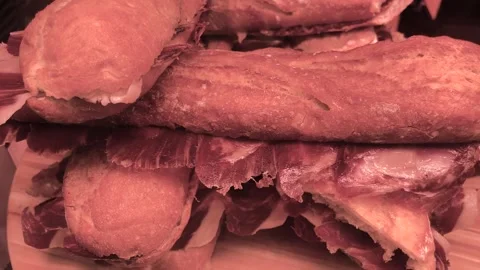 Delicious fresh bread with cured meats at a local market in Spain 스톡 동영상 304210817