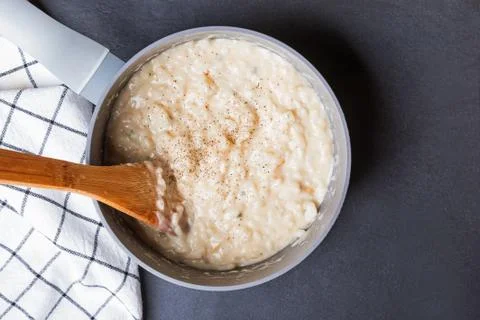 Delicious fresh cooked risotto with cheese in a pot Stock Photos