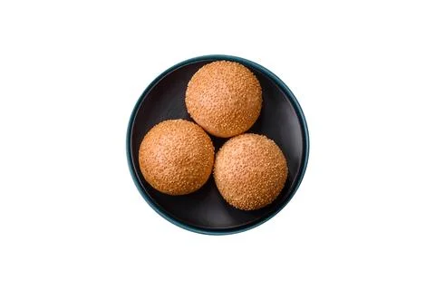 Delicious fresh crispy white round bread with seeds and grains Stock Photos