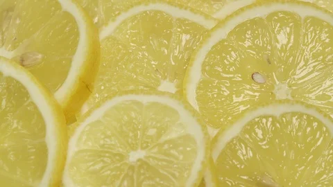 Delicious fresh lemon slices with thin zest macro view Stock Footage 124380700