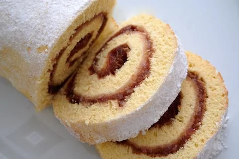 Delicious fresh roll with raspberry jam isolated on white Stock Photos