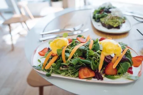 Delicious fresh salad in a rectangular plate on the table 스톡 사진