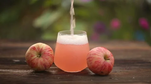 Delicious fresh squeezed apple juice in  transparent glass Stock Footage 102629649