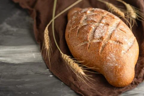 Delicious freshly baked bread on rustic background Stock-Fotos