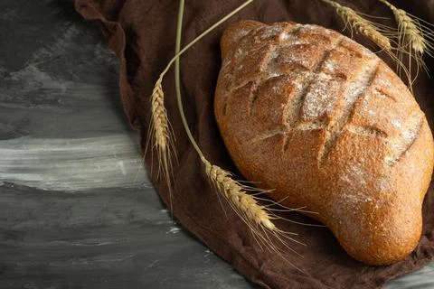 Delicious freshly baked bread on rustic background Stock Photos