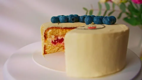 Delicious freshly made sponge cake bento decorated with berries and pattern with Stock Footage 240458453