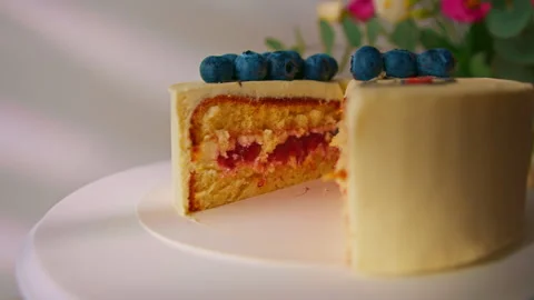 Delicious freshly made sponge cake bento decorated with berries and pattern with Stock Footage 240458506