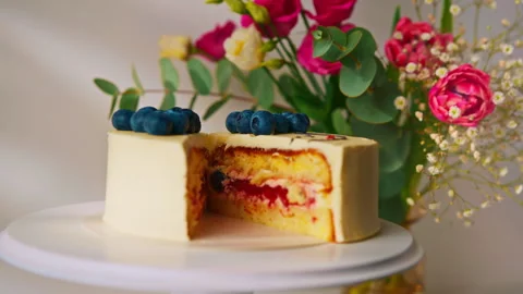 Delicious freshly made sponge cake bento decorated with berries and pattern with Stock Footage 240458518