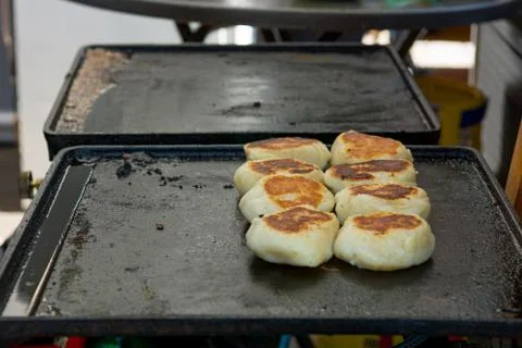 Delicious fried bread on a grill plate. Stock Photos