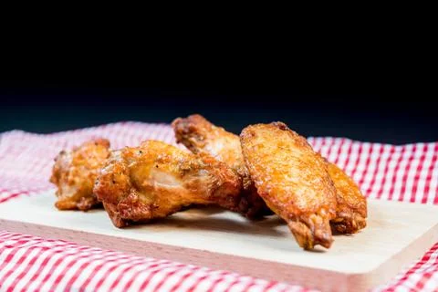 Delicious fried chicken wings on table Stock Photos