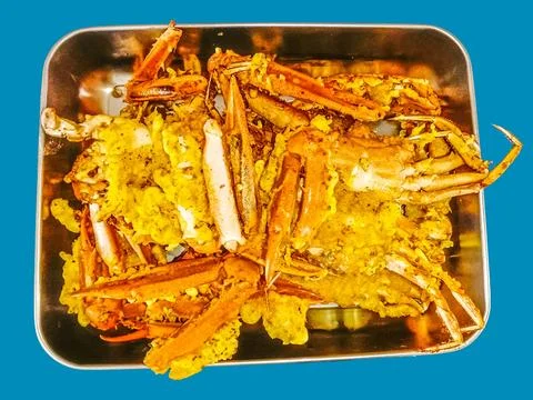 Delicious fried crab dish in a container Stock Photos