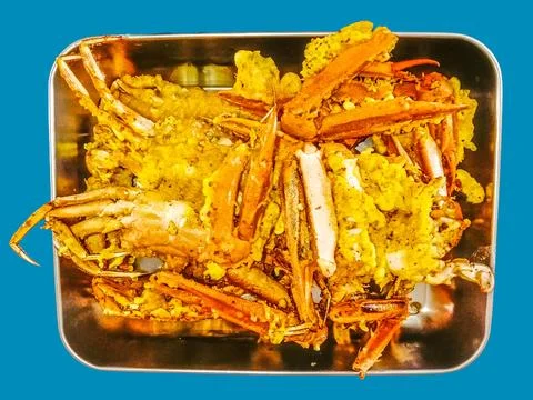 Delicious fried crab dish in a container Stock Photos