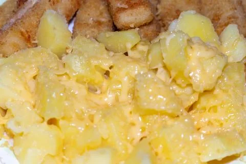 Delicious fried fish with pineapple chunks a tasty meal served warm Stock Photos