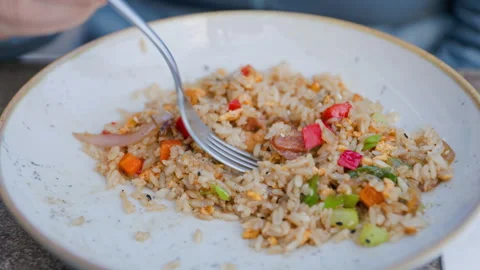Delicious Fried Rice with an Array of Colorful Fresh Vegetables Adding Flavor Stock Footage 282935710