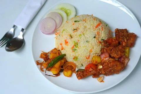 Delicious Fried Rice with Devil Chicken and Fresh Vegetables on White Plate Stock Photos
