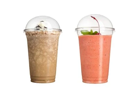 Delicious fruit smoothies in plastic cups, on a white background. Two milksha Stock Photos
